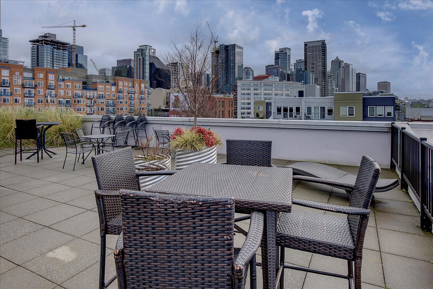 Rooftop deck with view of downtown Seattle at the Site 17 condo building