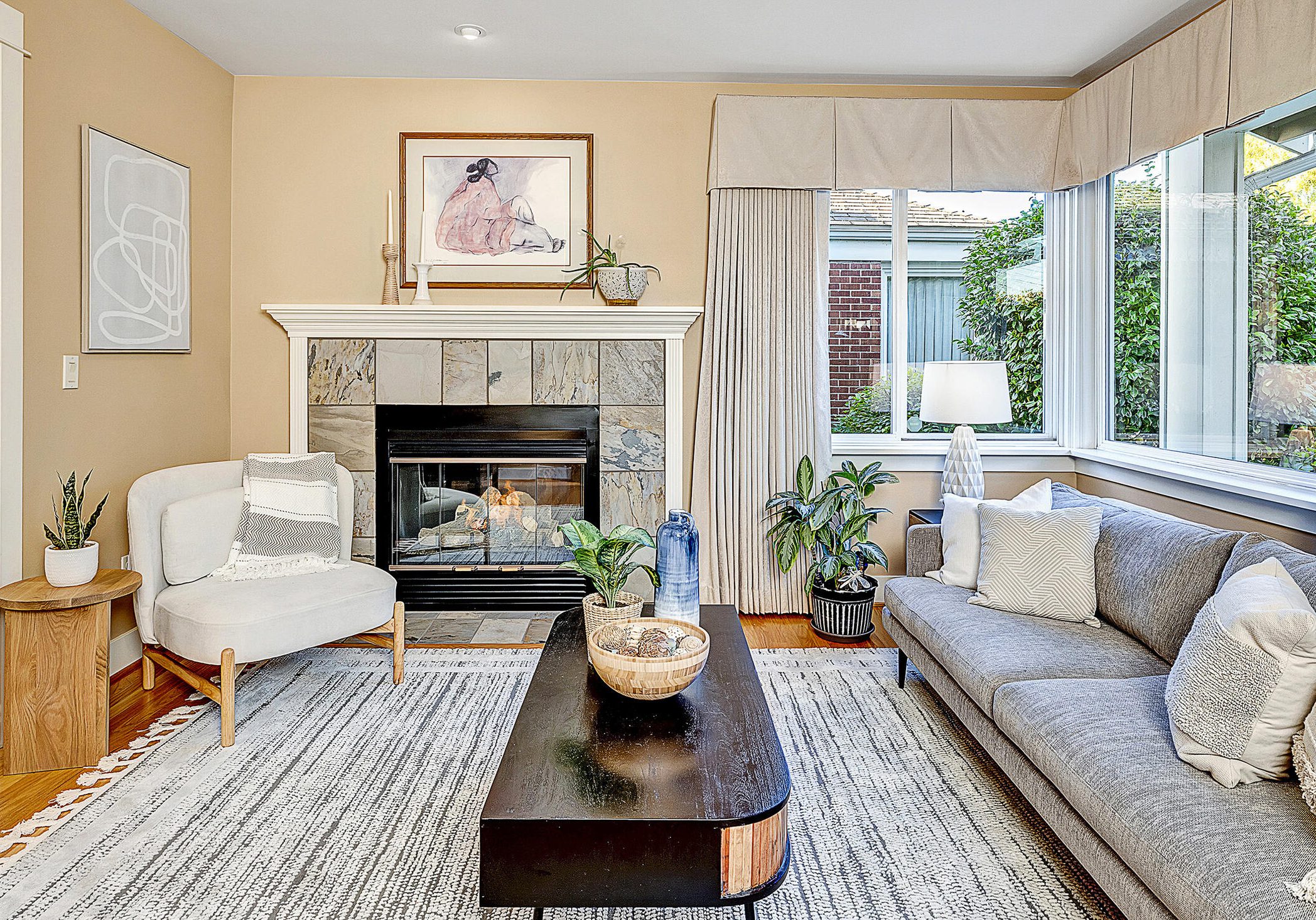 07-Pritchard Island Home-Living room with large picture windows and fireplace